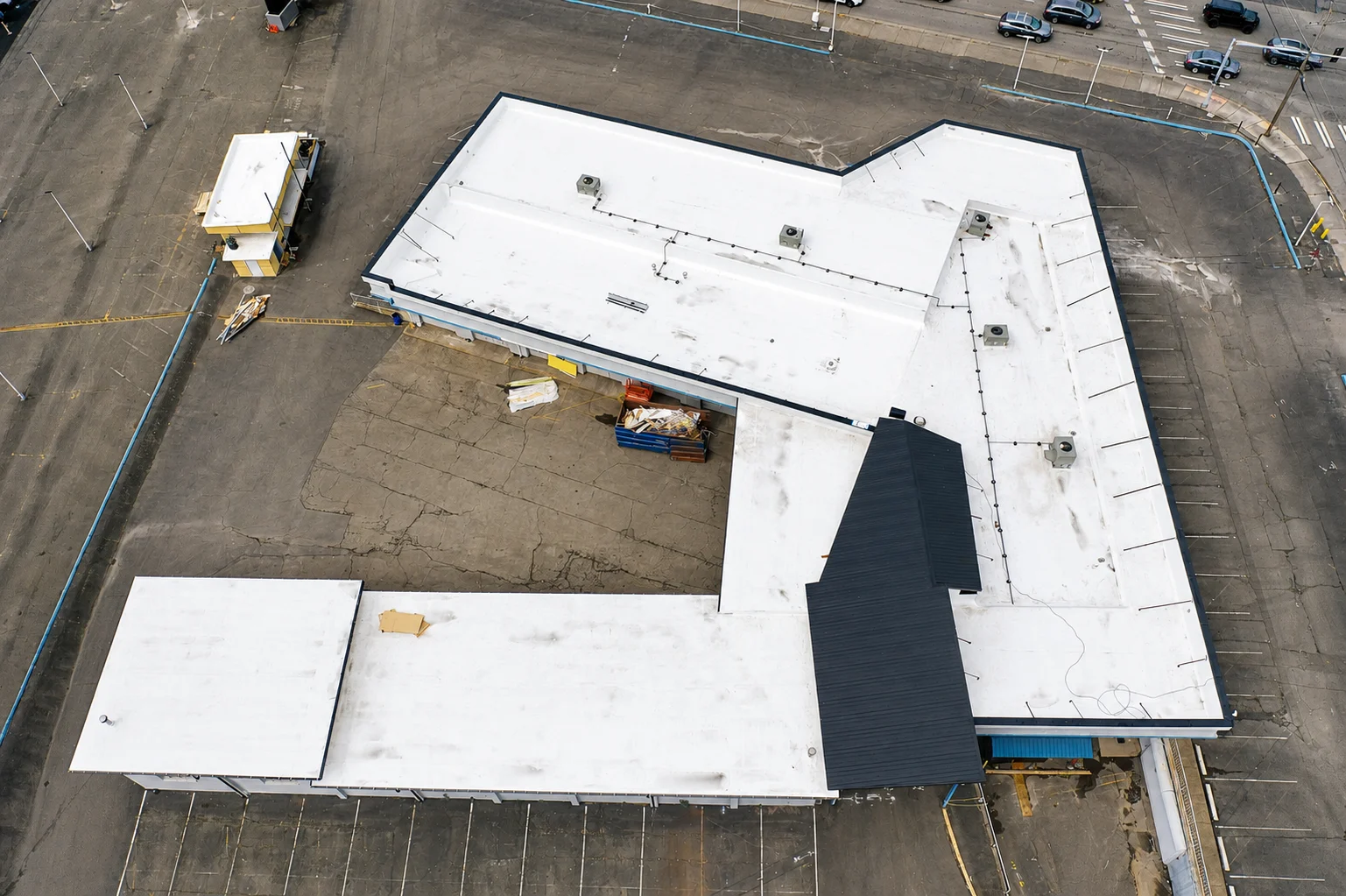 Restored white TPO roof after replacement, aerial