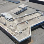 Aged, weathered roof before tear-off at Legend Auto Sales