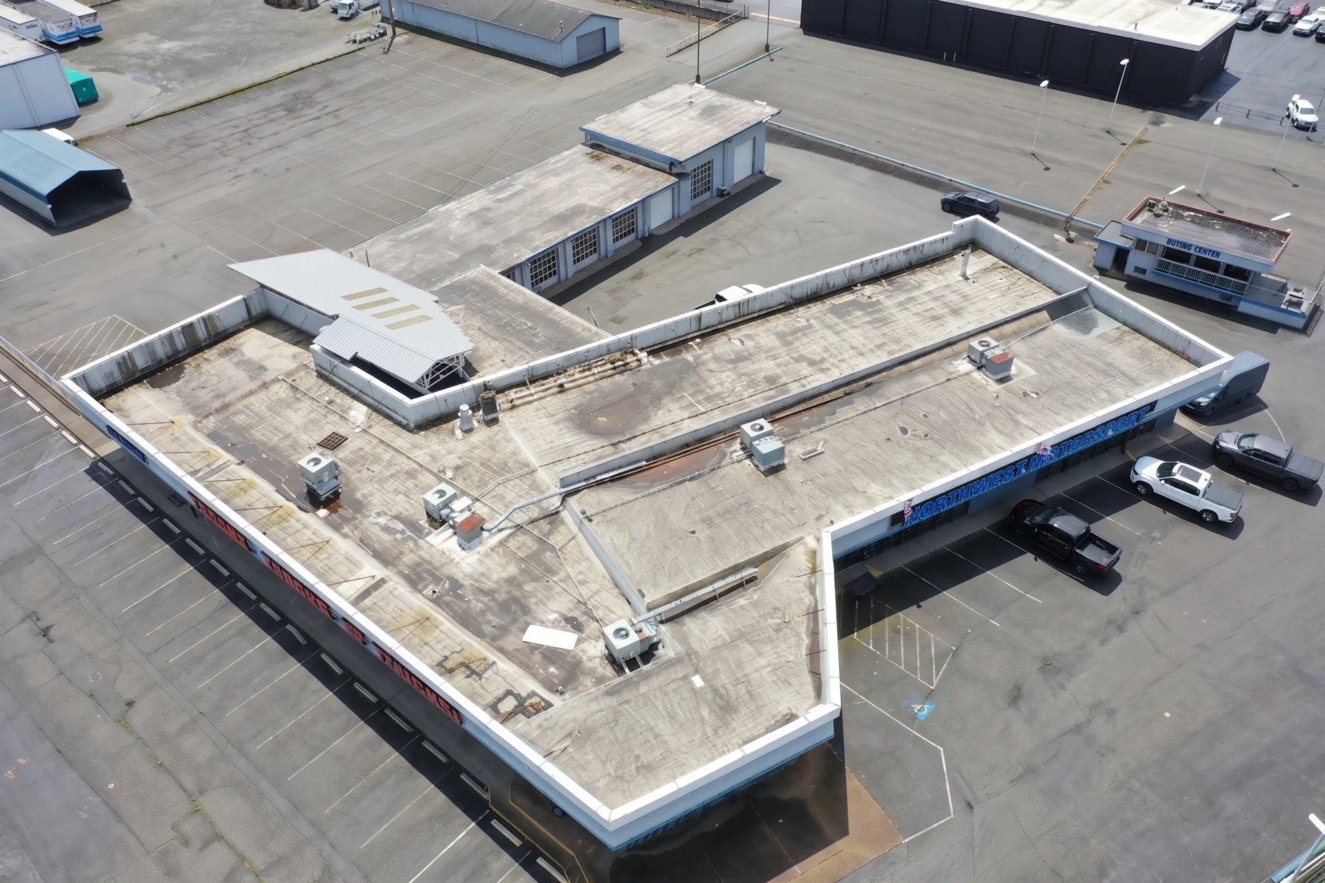 Aged, weathered roof before tear-off at Legend Auto Sales